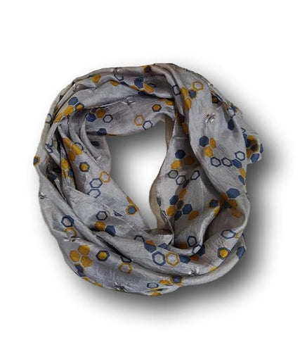 A grey silk scarf with a hexagon design