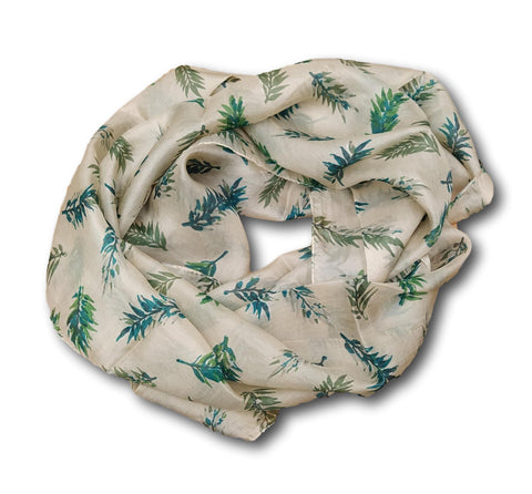 A beige silk scarf with a design of ferns 