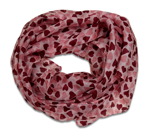 A silk scarf with a design of pink hearts